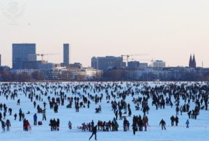 HAMBURG, GERMANY - FEBRUARY 10: Thousands of people stay on the frozen Aussenalster river during the 'Alstervergnuegen' on February 10, 2012 in Hamburg, Germany. The very popular annual city festival 'Alstervergnuegen' takes place around the Alster lake in Hamburg. Last time the Alster was official approved for the 'Alstervergnuegen' is 15 years ago. (Photo by Joern Pollex/Getty Images)